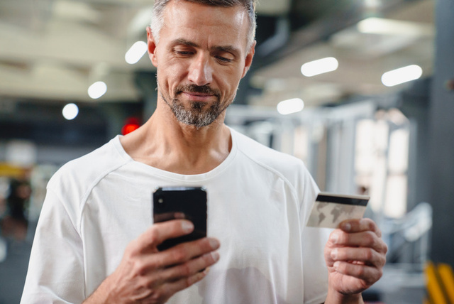 Patient paying with a phone and card