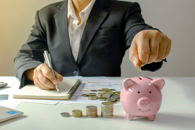 Saving money in a piggy bank