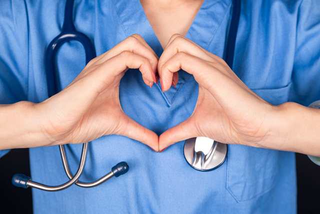 Provider making a heart with their hands